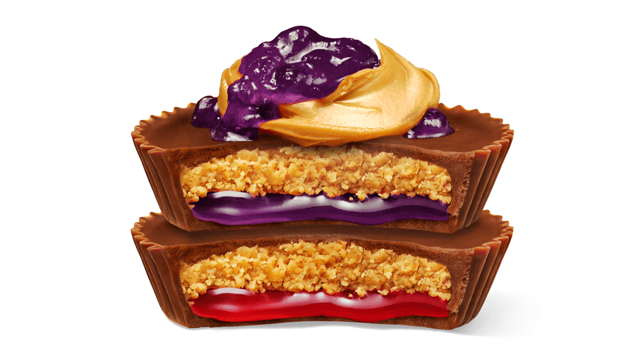 stack of reeses peanut butter and jelly flavored milk chocolate peanut butter cups