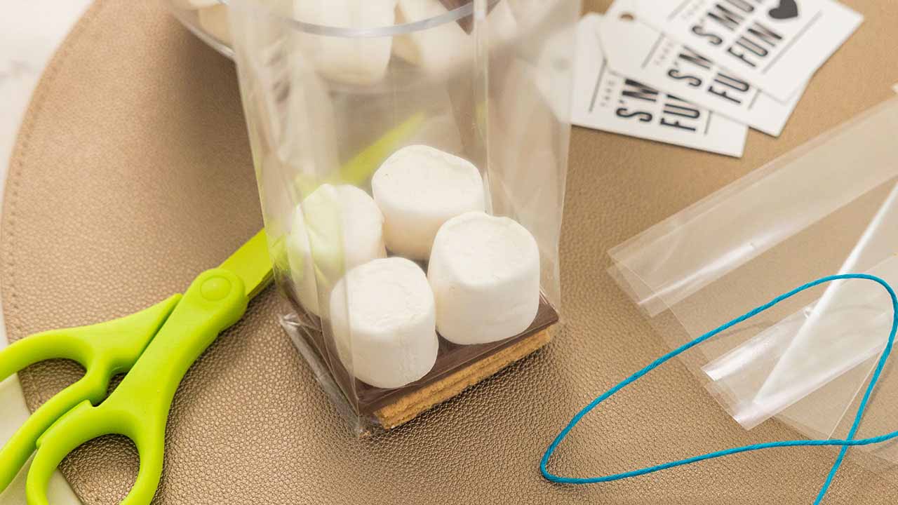 topping the milk chocolate bar half with marshmallows