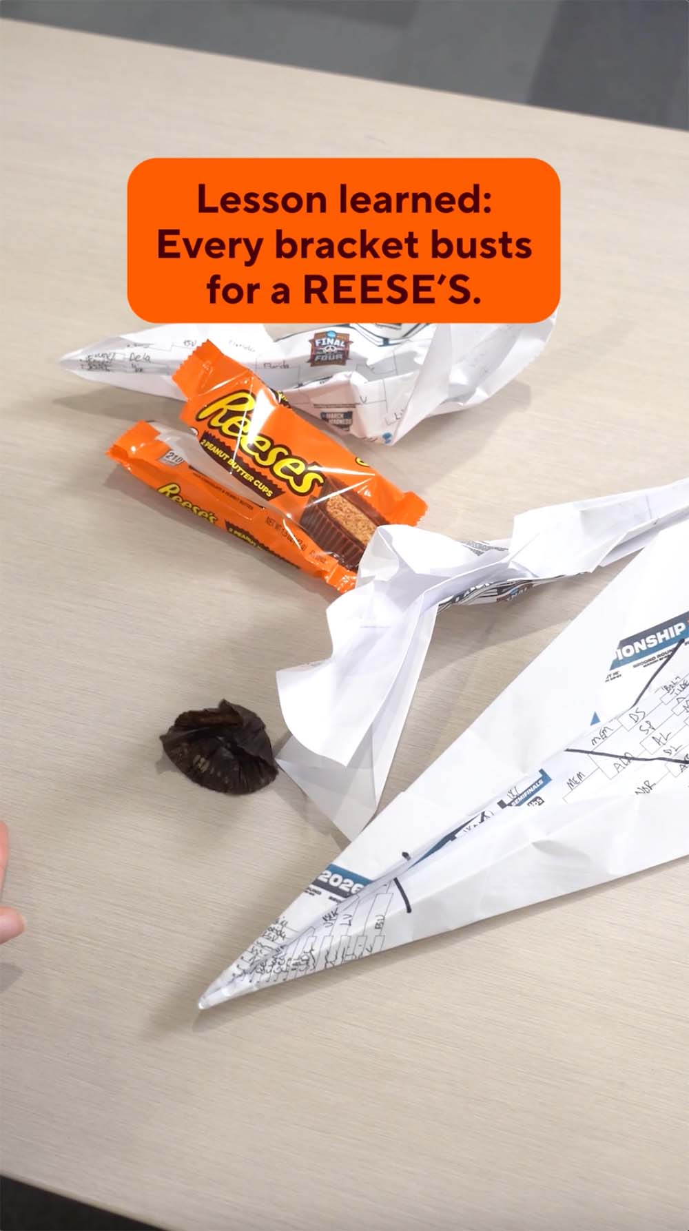 making and throwing paper airplanes at reeses peanut butter cups