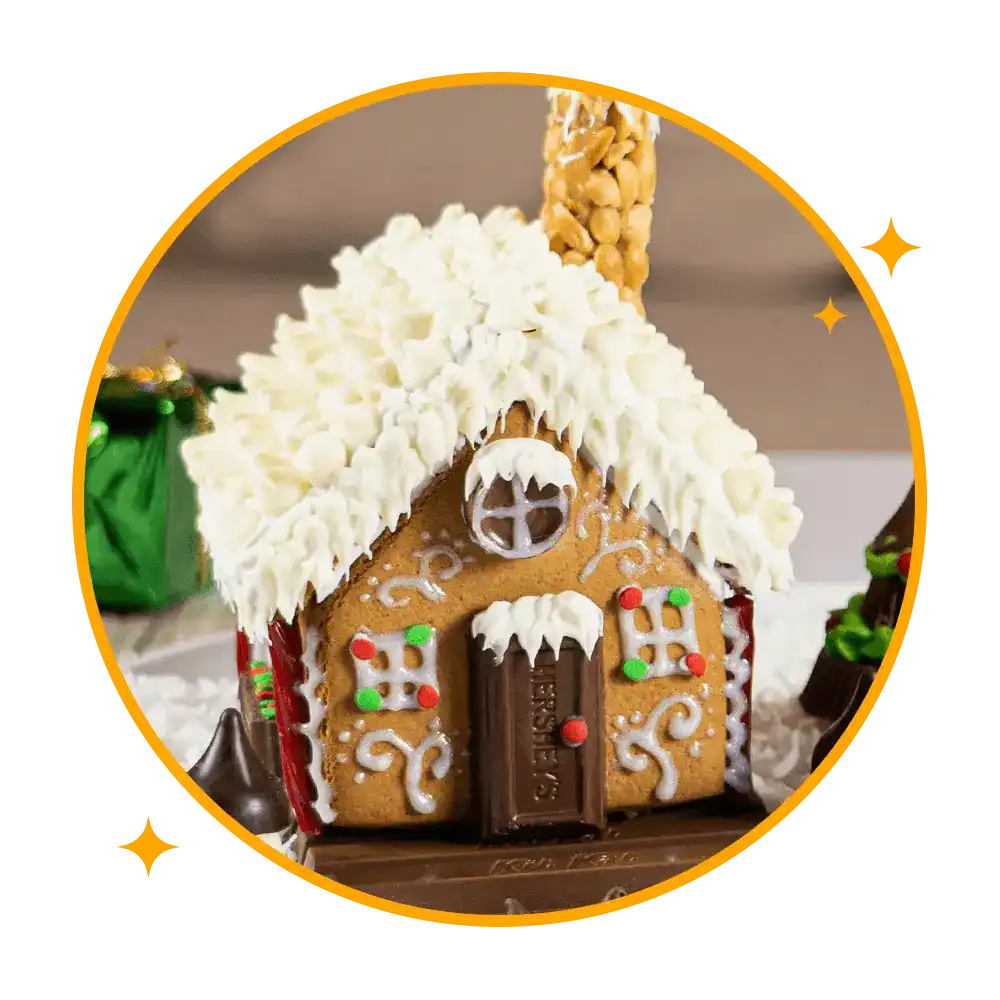 gingerbread house decorated with assorted hersheys candies