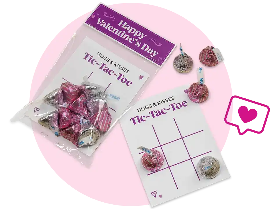 pair of valentines day tic tac toe cards topped with hersheys hugs and kisses candies