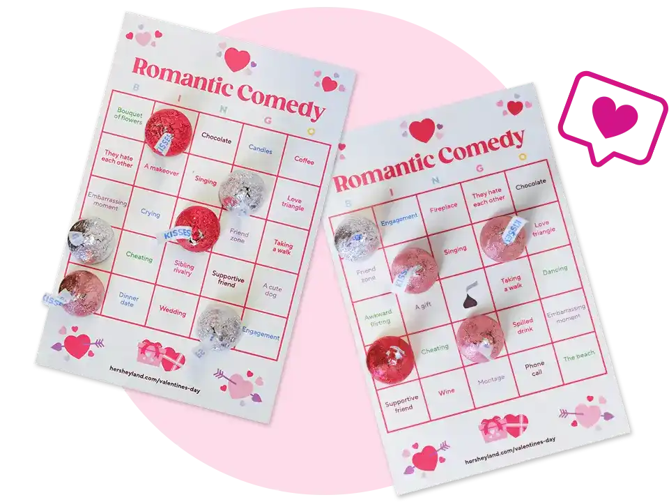 pair of romantic comedy bingo cards topped with hersheys kisses candies
