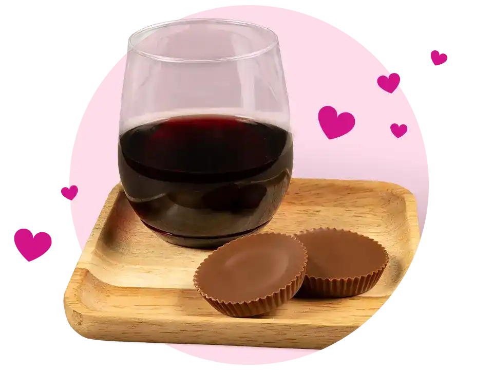 glass of wine paired with reeses milk chocolate peanut butter cups